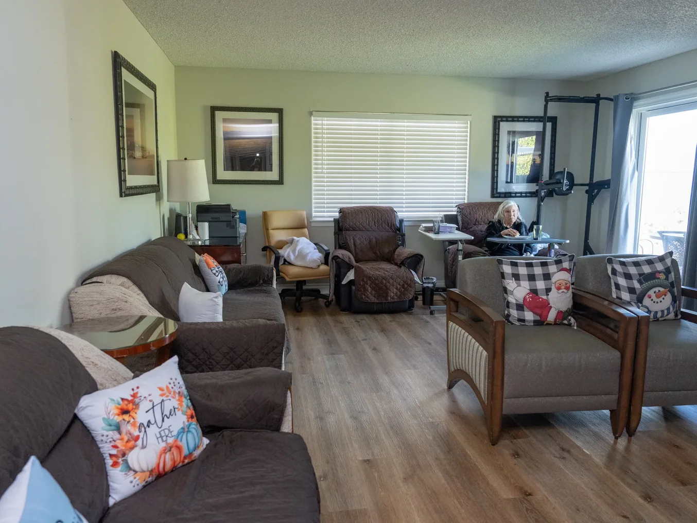 Comfortable common living room with brown furniture and natural lighting